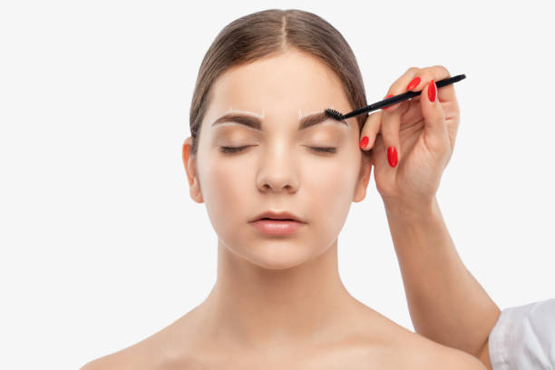 Step-by-step tutorial on how to fill in eyebrows with eyeshadow for a natural look.